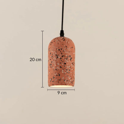 A terracotta-colored pendant light with a speckled terrazzo pattern, shown with dimension lines indicating a height of 20 cm and a width of 9 cm against a solid beige background.
