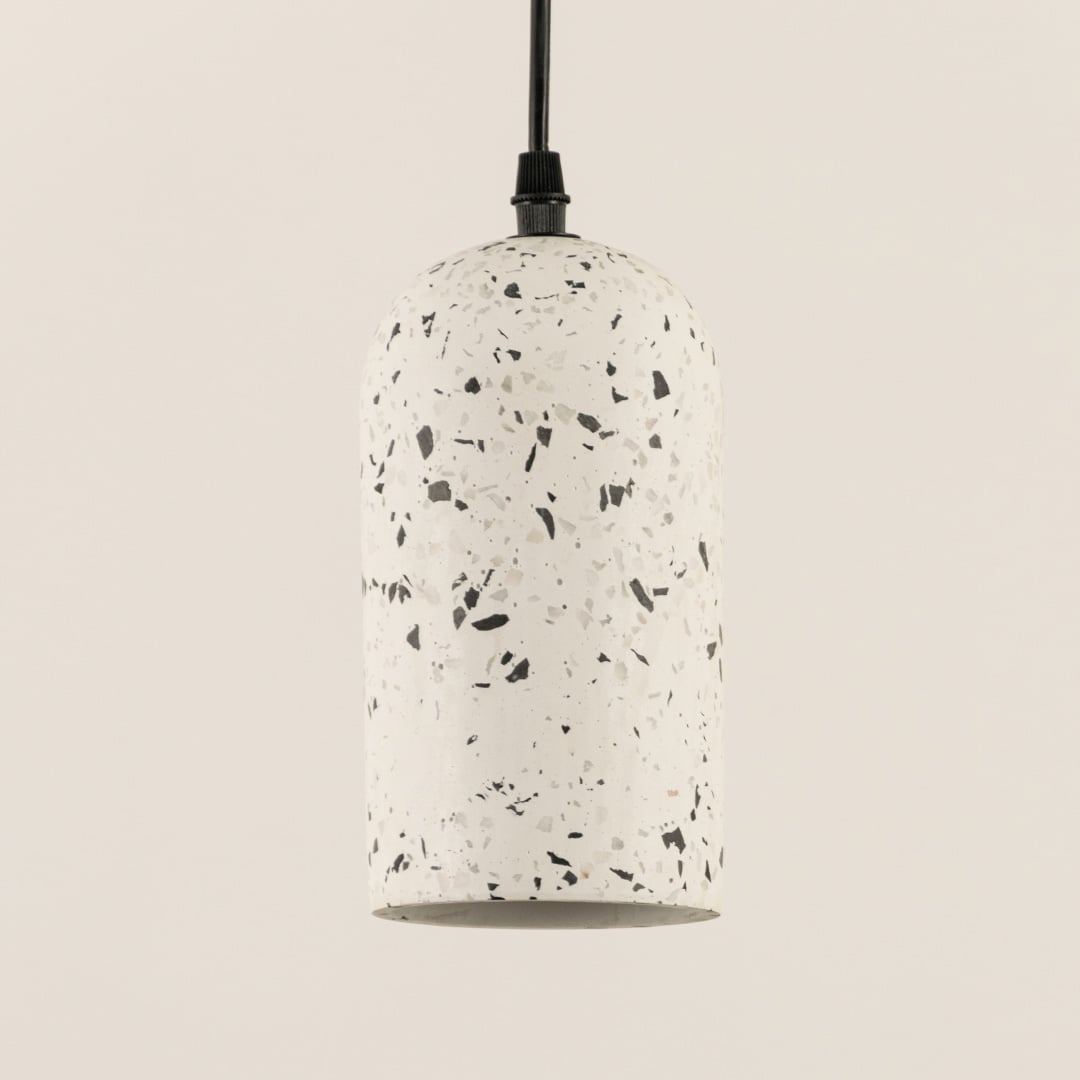 Closeup of white terrazzo pendant light showcasing premium stone texture and refined craftsmanship.