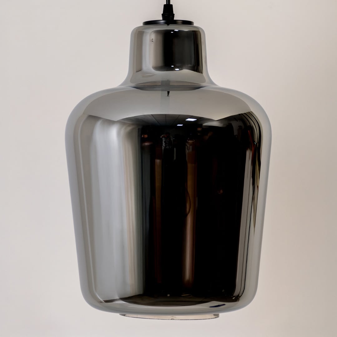 Closeup view of the smoked-glass pendant light showing detailed reflections smooth curved design and premium glossy finish.