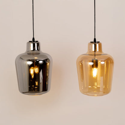 Grouped display of smoked-glass pendant lights highlighting their reflective finish curved silhouette and sleek modern style.