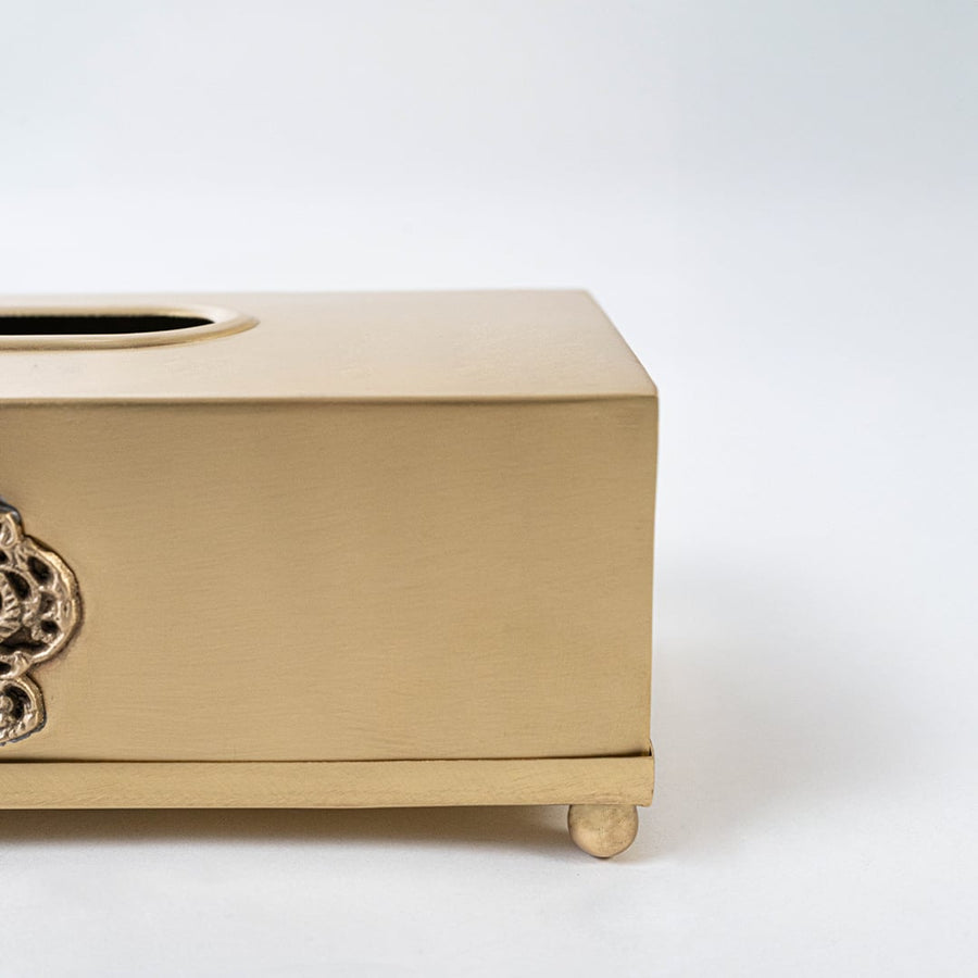Gold rectangular tissue holder with floral carving displayed on white background showing top tissue slot clearly.