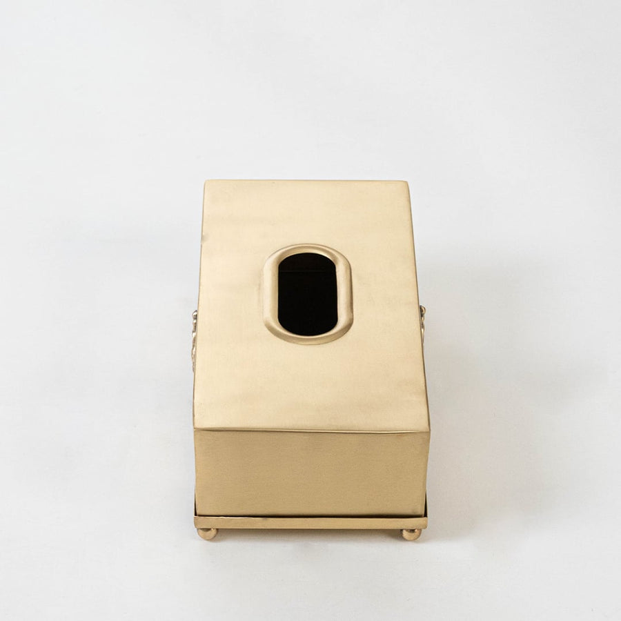 Gold metal tissue holder with 25 cm length 13 cm width and 9 cm height shown with engraved motif and foot base.