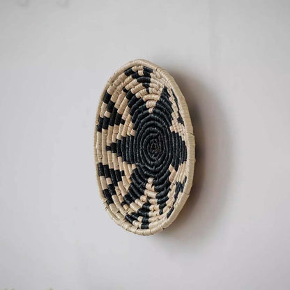 Side profile of the Black Star handwoven wall basket showing its depth and sturdy handmade structure crafted from natural materials for wall decoration.