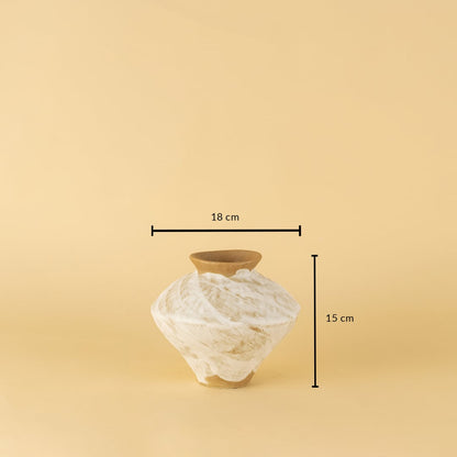 Rustic white and brown ceramic vase with swirled pattern shown with 15 cm height and 18 cm width for reference