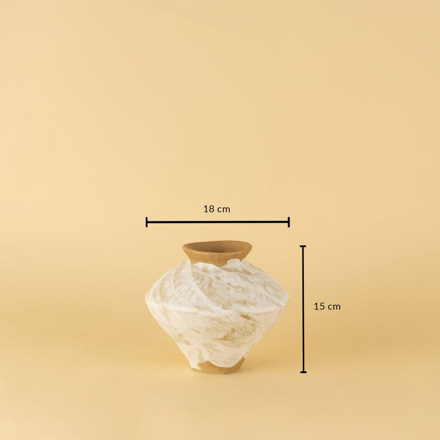 Rustic white and brown ceramic vase with swirled pattern shown with 15 cm height and 18 cm width for reference