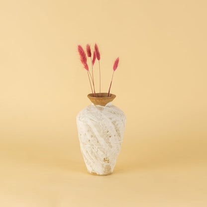 White rustic ceramic vase with terracotta rim styled on wooden table adding artisanal charm to modern home decor.