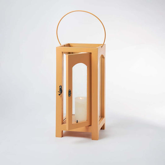 Minimal wooden lantern with clear glass panels and metal handle for elegant decor styling use.