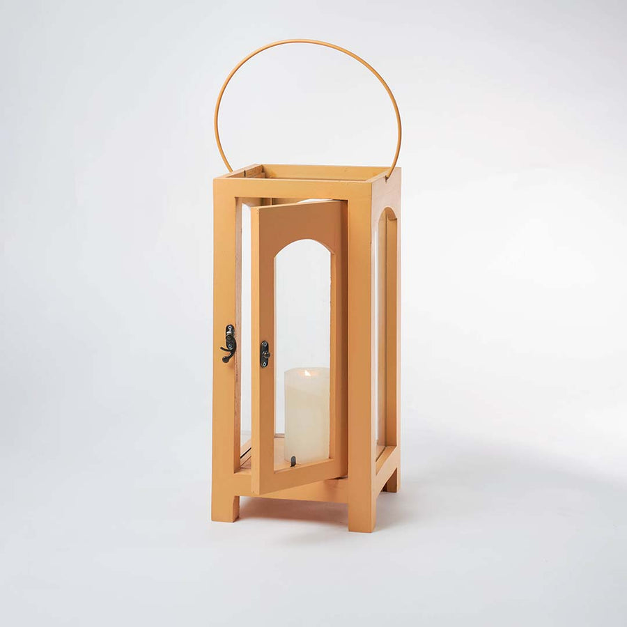 Minimal wooden lantern with clear glass panels and metal handle for elegant decor styling use.