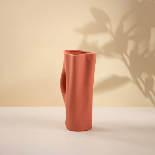 Terracotta ceramic decorative vase with sculptural silhouette for contemporary tabletop styling and modern home decor.