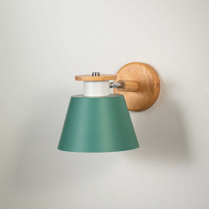 Wall light with green metal shade and gold mount on neutral background modern decorative lighting ideal for bedroom living room decor.