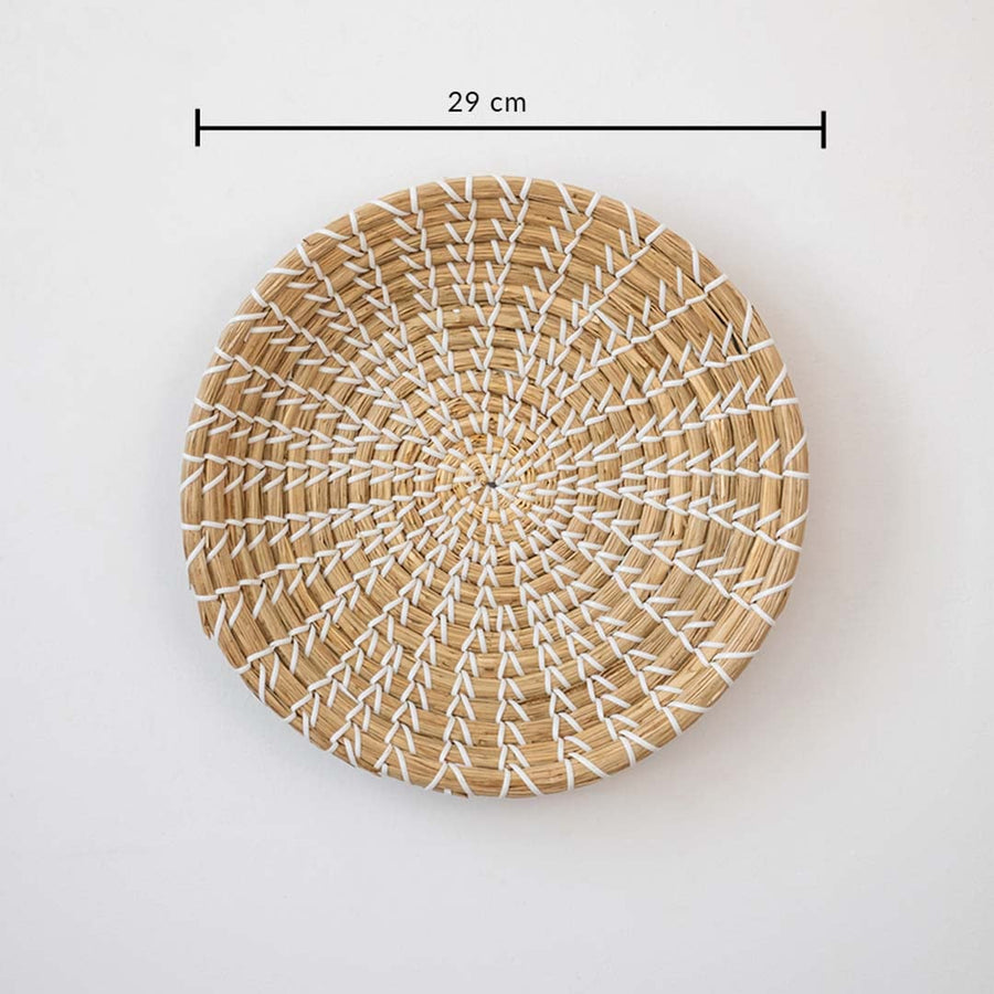 Round handcrafted wall basket in natural beige fiber showing 28 cm diameter suitable for minimal modern wall decor use.