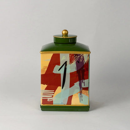 Abstract design jar with green lid and golden knob shown clearly on white background with vibrant detailing.