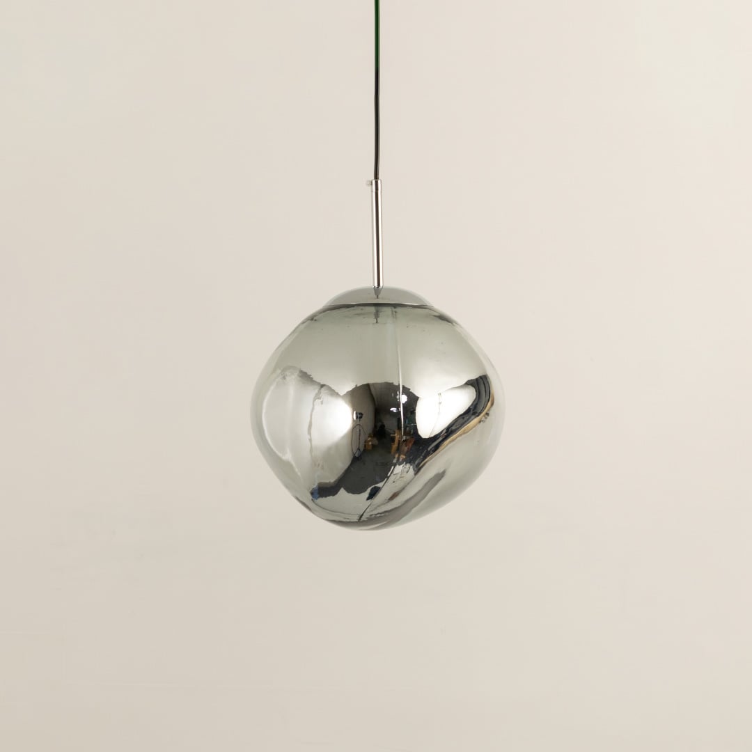 Silver glass globe pendant light with polished surface designed for stylish contemporary living spaces.