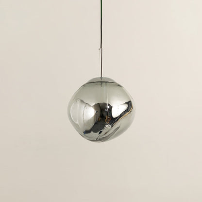 Silver glass globe pendant light with polished surface designed for stylish contemporary living spaces.