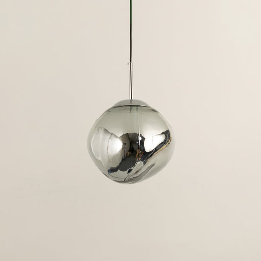 Silver glass globe pendant light with polished surface designed for stylish contemporary living spaces.