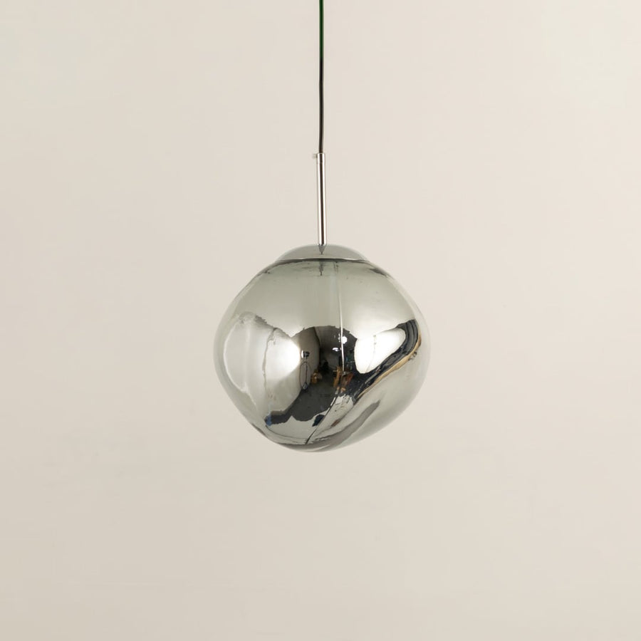 Silver glass globe pendant light with polished surface designed for stylish contemporary living spaces.