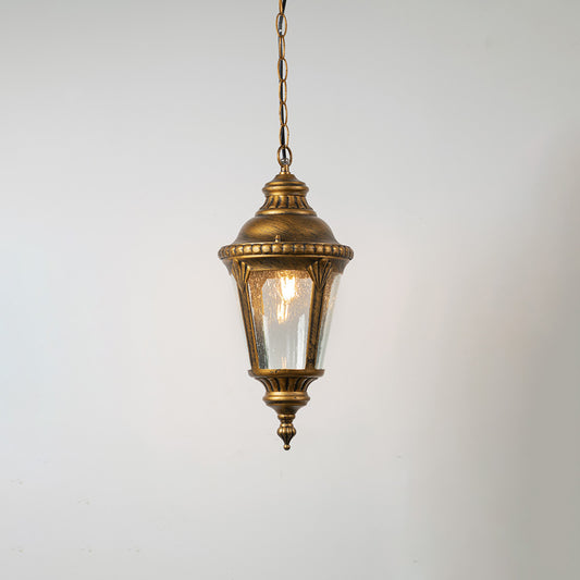 Vintage brass hanging lantern light with clear textured glass shade for elegant balcony and outdoor decor.