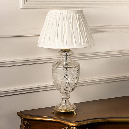 Clear etched glass table lamp with pleated fabric shade designed for elegant traditional decor and ambient lighting indoors.