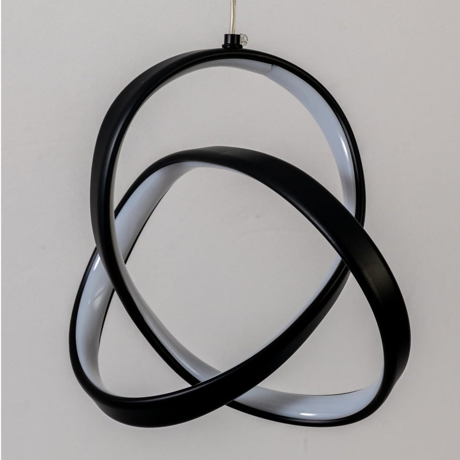 Closeup of black metal LED pendant light highlighting sculptural design and premium finish.
