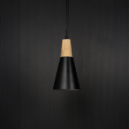 Modern pendant light bulb off on black background with black conical metal shade and natural wooden top for interiors.
