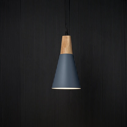 Pendant light with wooden top and matte shade displayed on black background for elegant lighting presentation.