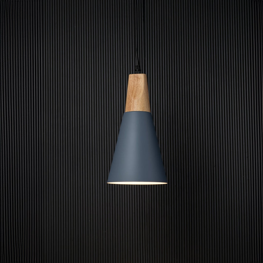 Pendant light with wooden top and matte shade displayed on black background for elegant lighting presentation.