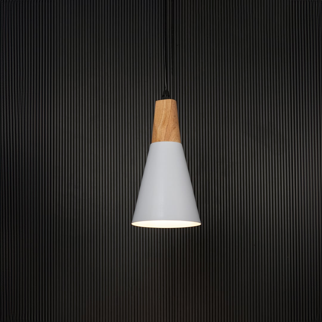 White cone pendant light with wooden finish turned on against black background is a stylish hanging lamp for kitchen island or dining area.