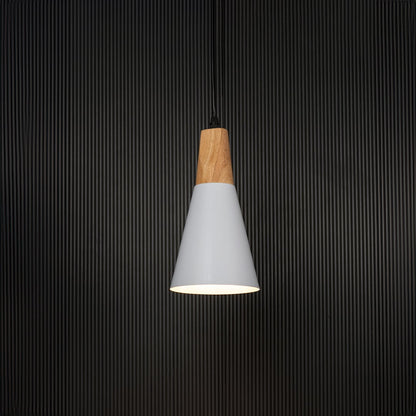 White cone pendant light with wooden finish turned on against black background is a stylish hanging lamp for kitchen island or dining area.
