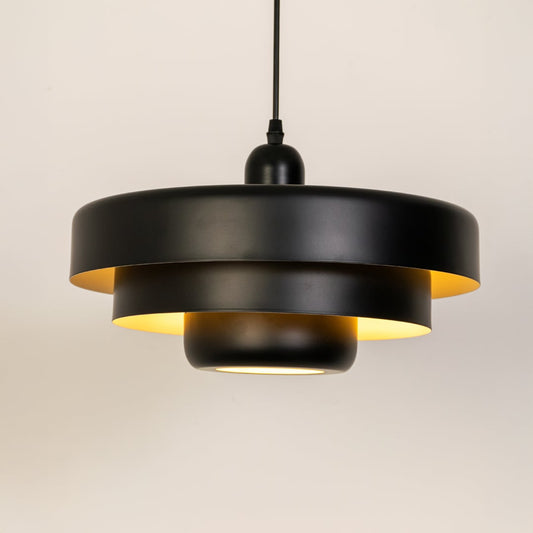 Black metal pendant light with warm glow perfect for kitchen island dining room and ceiling decor.