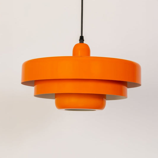 Orange metal pendant light with tiered profile for bedroom dining room and stylish ceiling decor.