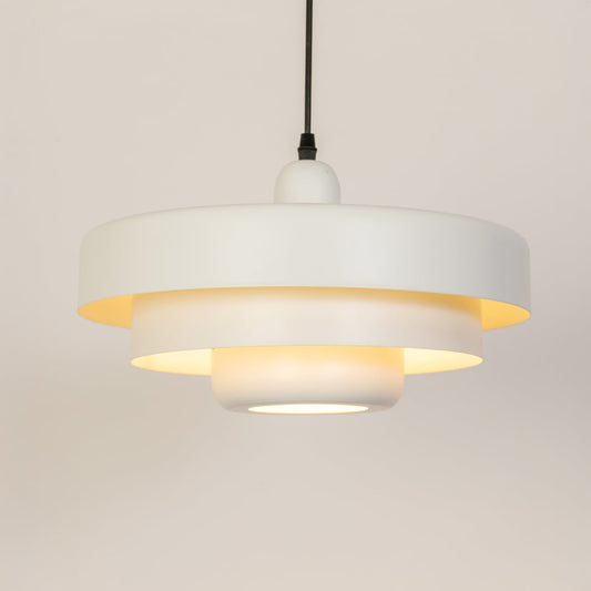White metal pendant light with warm glow ideal for bedroom dining room and ceiling decor.