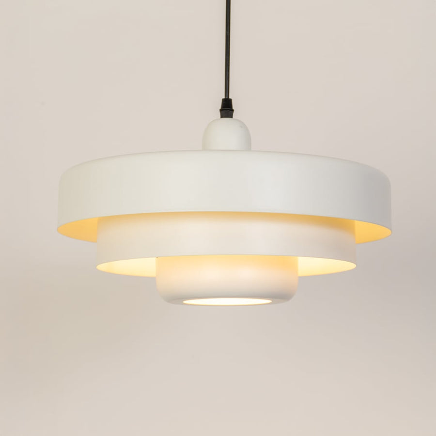 White metal pendant light with warm glow ideal for bedroom dining room and ceiling decor.
