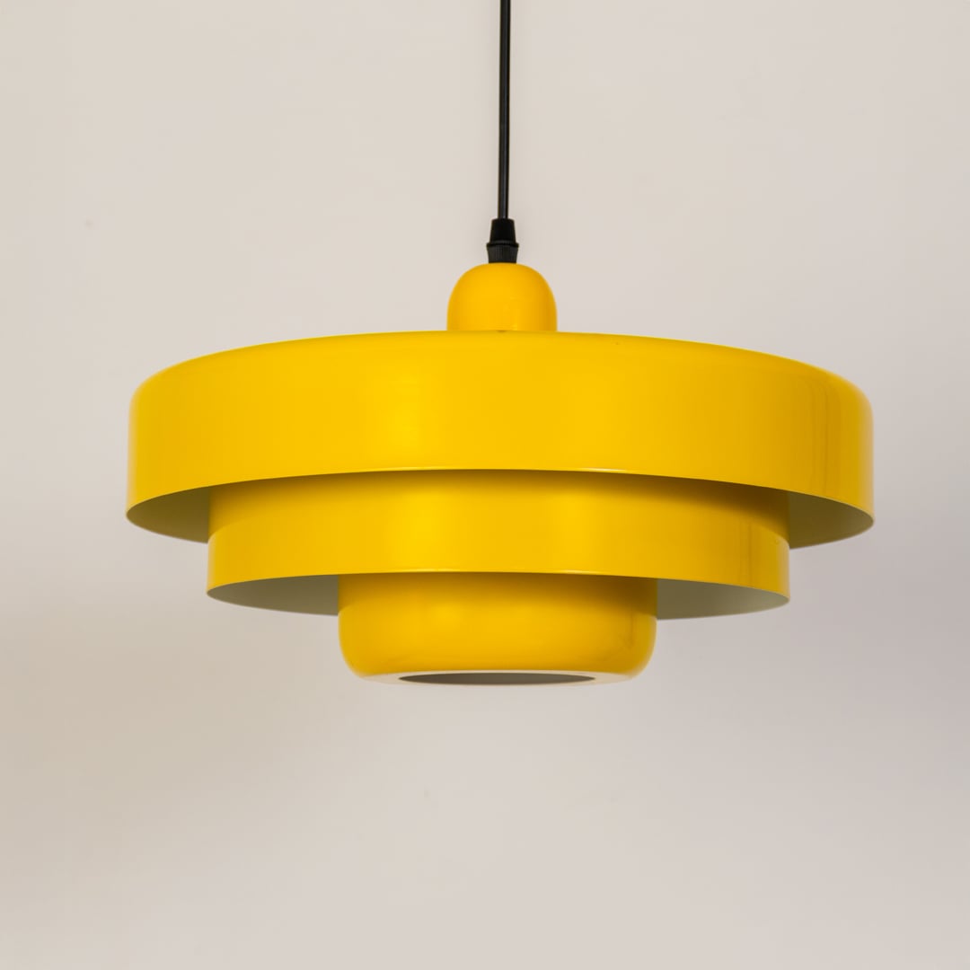 Yellow metal pendant light with light off displayed on white background for modern kitchen dining and home decor.