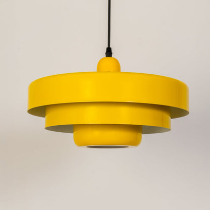 Yellow metal pendant light with light off displayed on white background for modern kitchen dining and home decor.