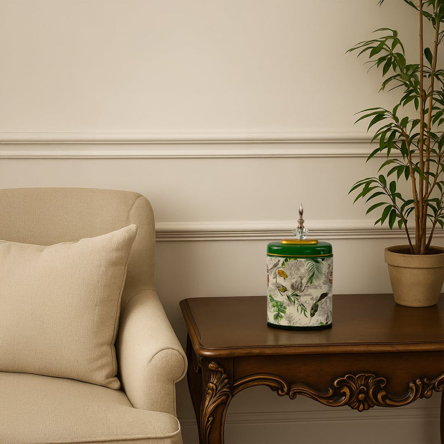 Green tropical decorative jar displayed on wooden side table adding elegance to cozy beige living room decor.