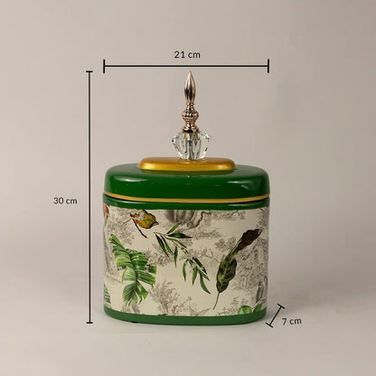 Green tropical jar measuring 30 cm in height and 21 cm in width with intricate tropical leaf artwork.