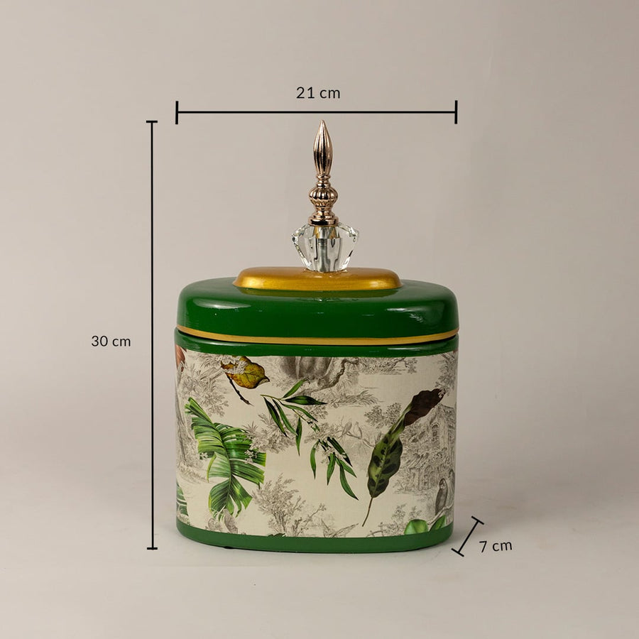 Green tropical jar measuring 30 cm in height and 21 cm in width with intricate tropical leaf artwork.