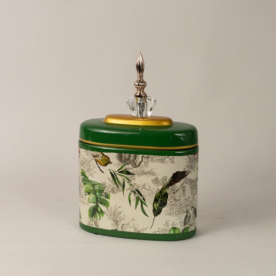 Side view of green tropical jar showing smooth rounded edges  glossy finish  and detailed tropical prints.