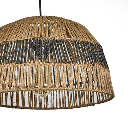 Closeup of jute and black woven pendant light showing intricate handwoven texture and natural craftsmanship for organic home decor.