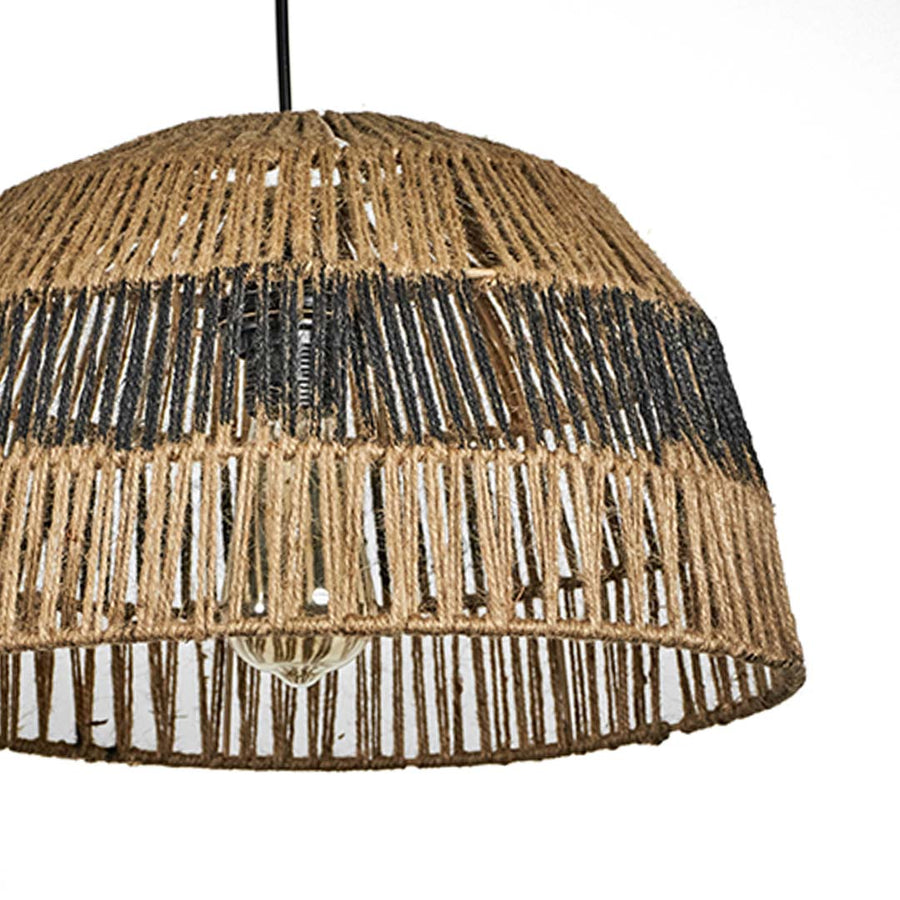 Closeup of jute and black woven pendant light showing intricate handwoven texture and natural craftsmanship for organic home decor.