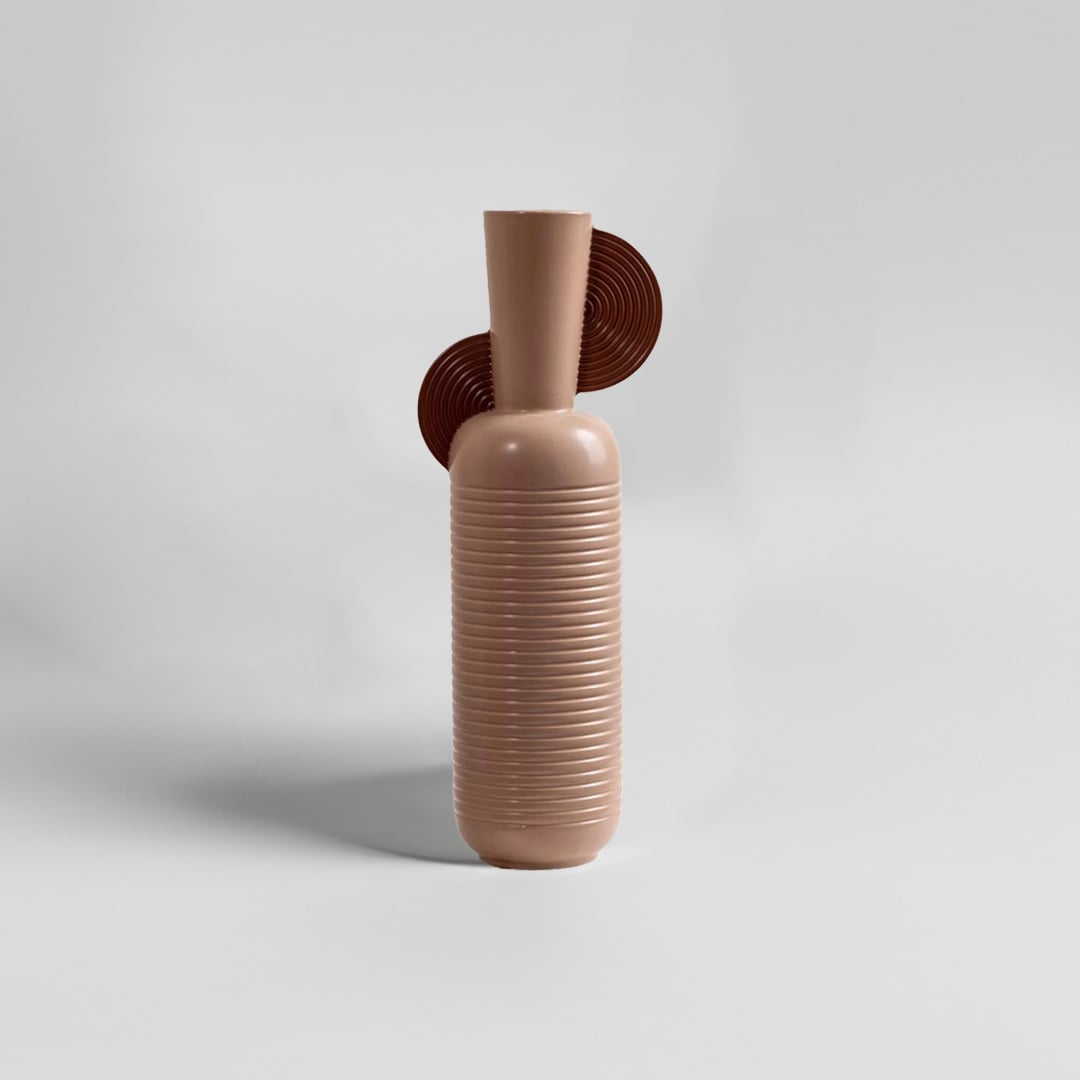 Tall ribbed ceramic vase in warm brown with sculptural back detail shown on white background ideal for modern living room and shelf decor.