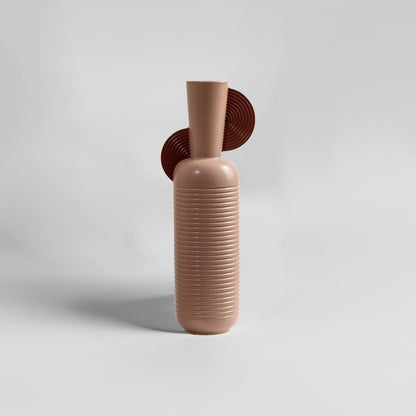 Tall ribbed ceramic vase in warm brown with sculptural back detail shown on white background ideal for modern living room and shelf decor.
