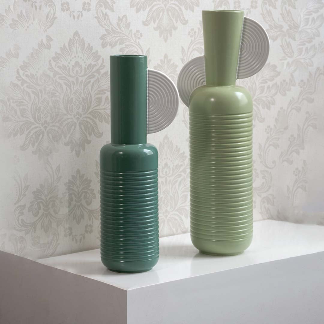 Teal ribbed ceramic vase styled with coordinated decor pieces perfect for modern interiors and elegant artistic home arrangements.
