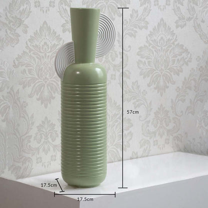 Mint green ribbed vase with spiral accent shown with 57 cm height and 17.5 cm width offering a clear accurate size reference.