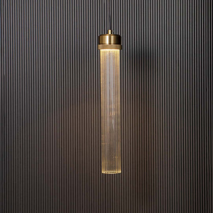 Tubular glass pendant lamp glowing with golden holder ribbed glass design elegant ceiling light for luxury modern home interiors.