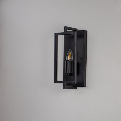 Wall light with black metal rectangular frame and exposed bulb design ideal for modern bedroom living room and hallway.