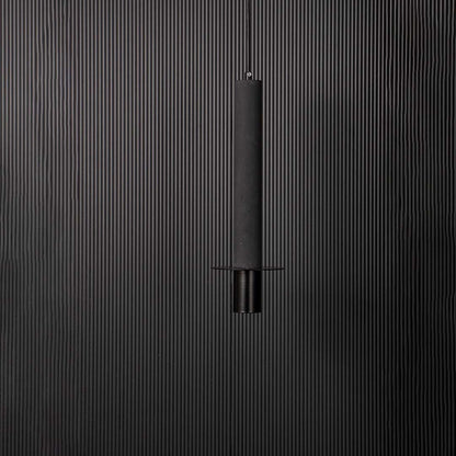 Closeup of slim black cylindrical pendant ceiling light showing fine details and modern minimalist hanging design style.