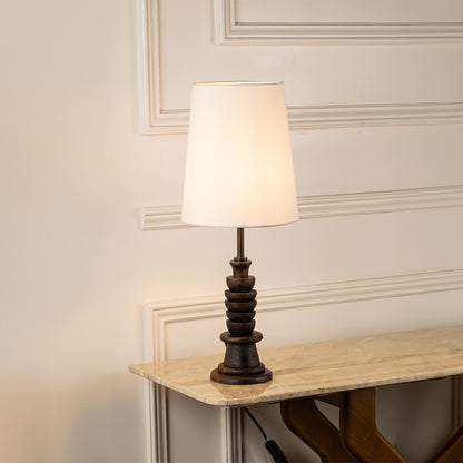 Table lamp with white fabric shade and detailed base perfect for bedroom or living room table decor styling on clean white background.