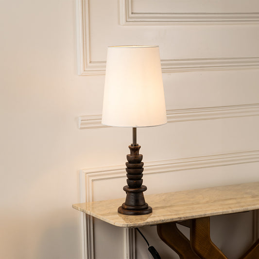 Table lamp with white fabric shade and detailed base perfect for bedroom or living room table decor styling on clean white background.