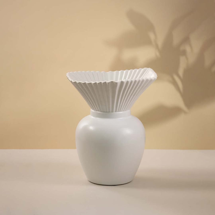 White ceramic vase with textured pleated top and smooth glossy base displayed on white background ideal for minimal home styling.